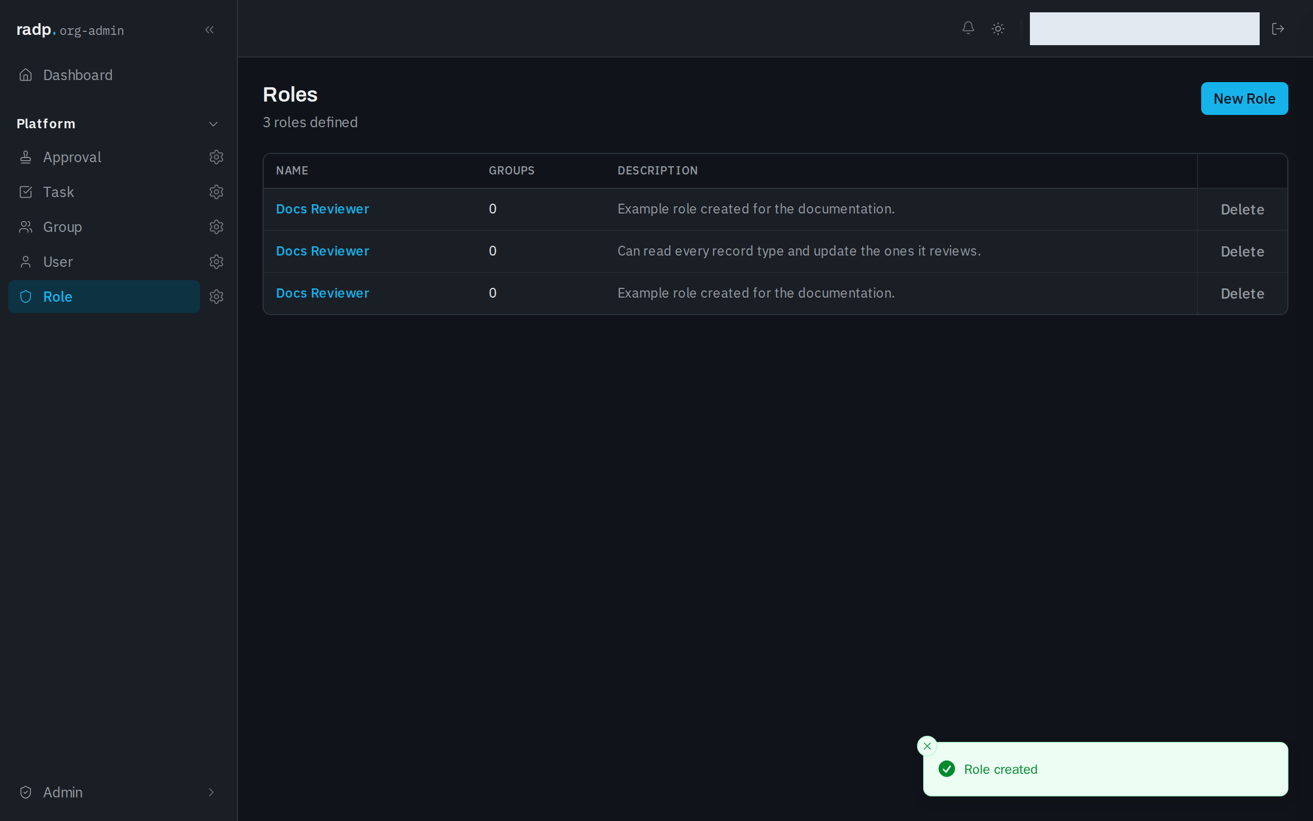 The Roles list with a newly created role in it and a confirmation message